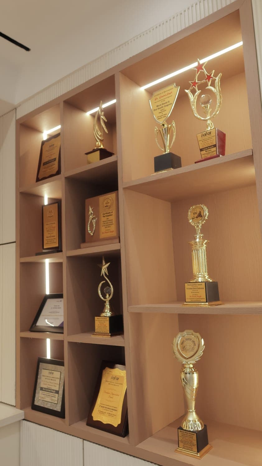 Awards and certificates earned by the clinic's doctors on display