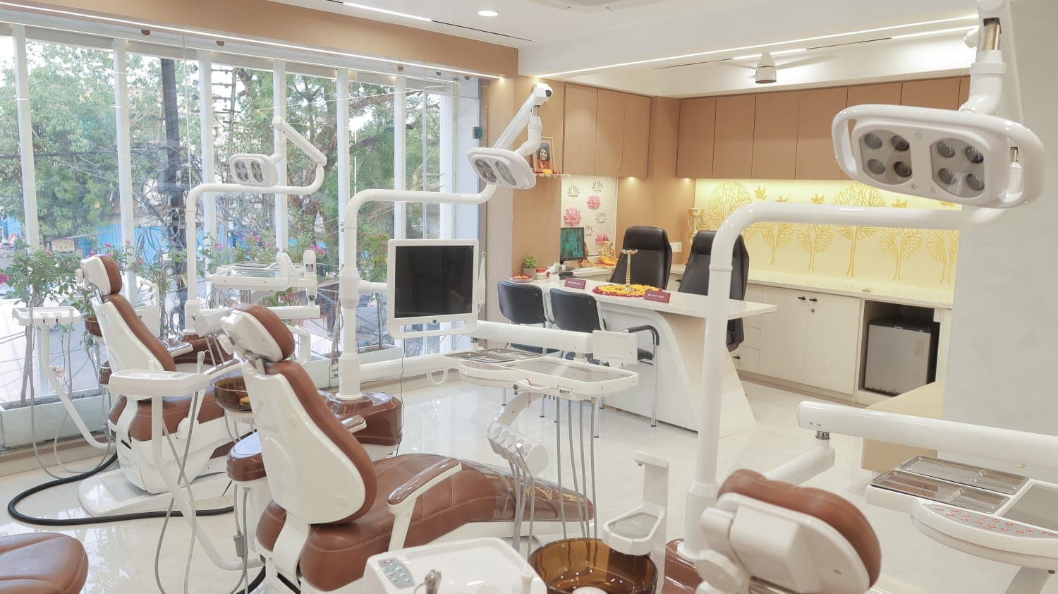 Dental chairs with the doctors' consultation desk in the background